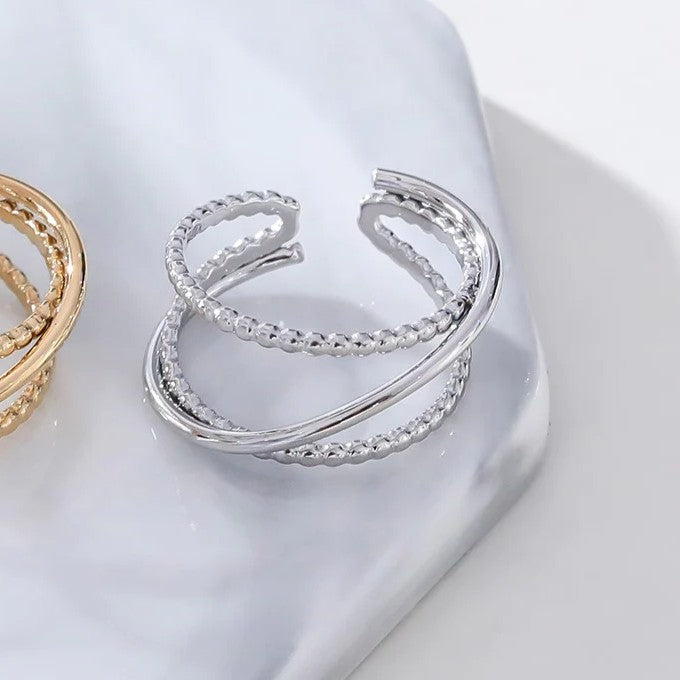 Bague fils croisés ajustable en acier inoxydable finition poli & perlé
