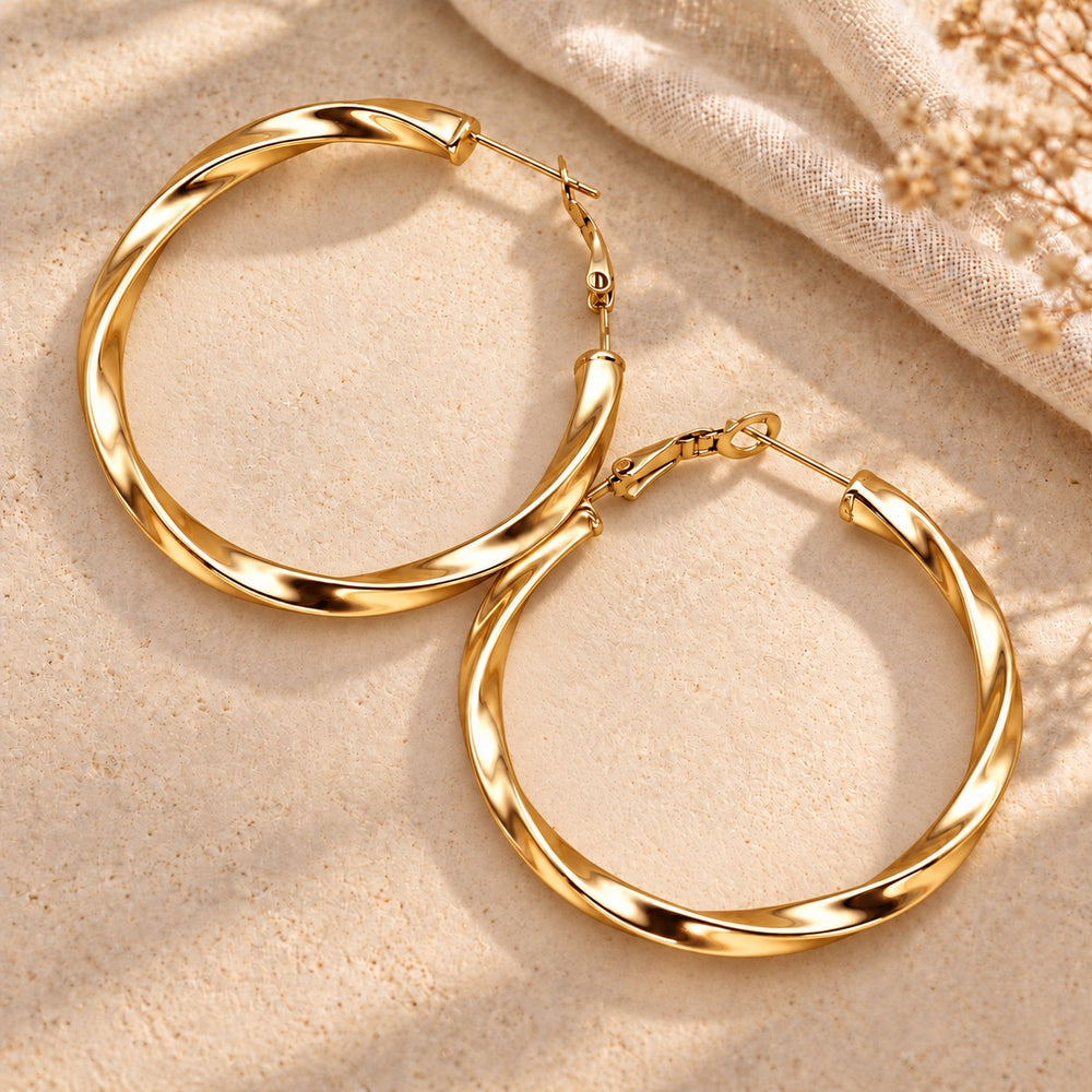 Boucles d'oreilles créole torsadée en acier inoxydable - version dorée ou argenté - 60mm