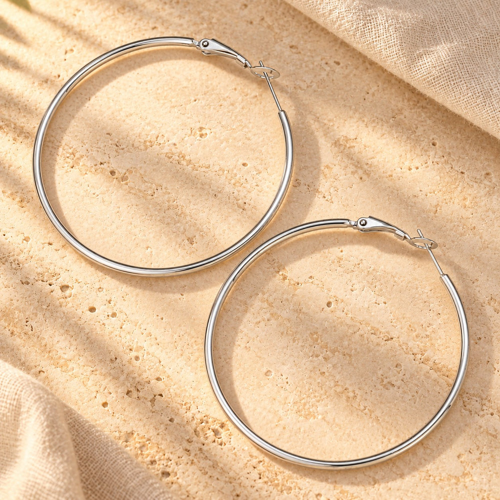 Boucles d'oreilles créole en acier inoxydable - version doré ou argenté - 50mm