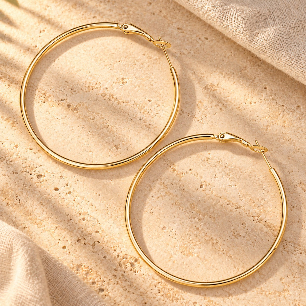 Boucles d'oreilles créole en acier inoxydable - version doré ou argenté - 50mm