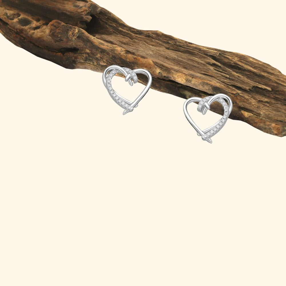 Boucles d’oreilles cœur noué en argent 925 rhodié serties de zirconia blancs