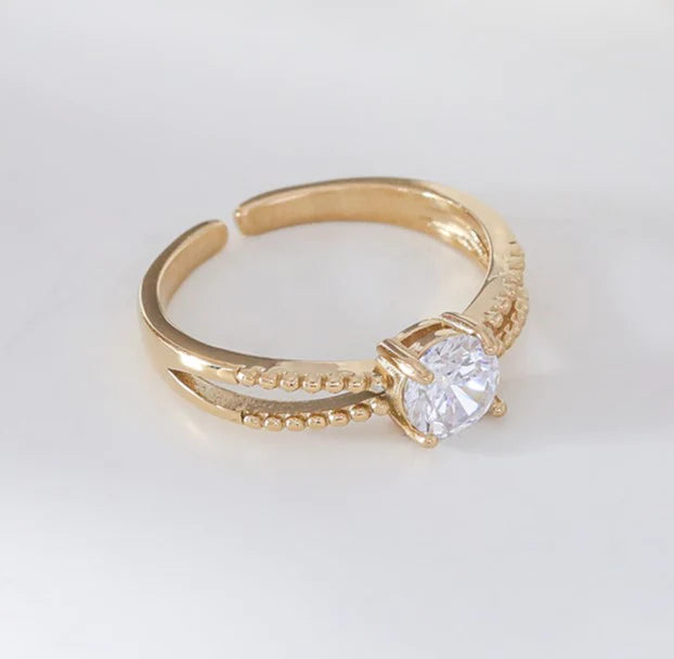 Bague solitaire en acier inoxydable doré avec strass central