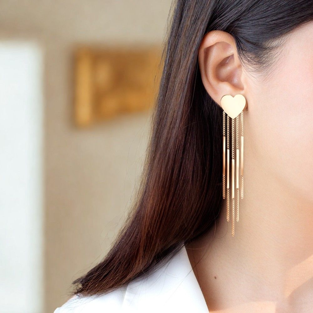 Boucles d’oreilles cœur en acier inoxydable 316L doré rose avec chaînettes pendantes portées