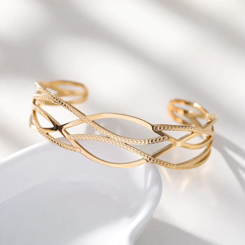Bracelet manchette acier inoxydable doré motif entrelacé