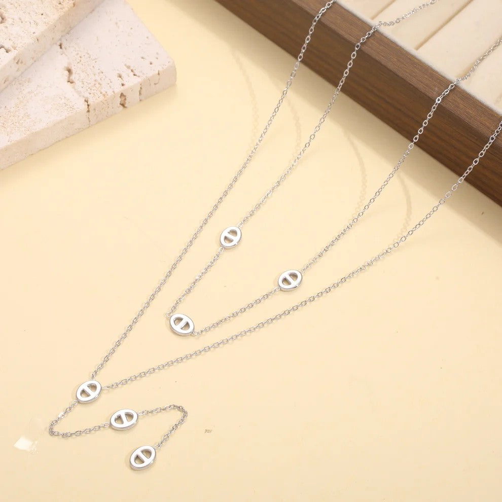 Collier double rang en acier inoxydable avec motifs ovales et chaîne pendante,